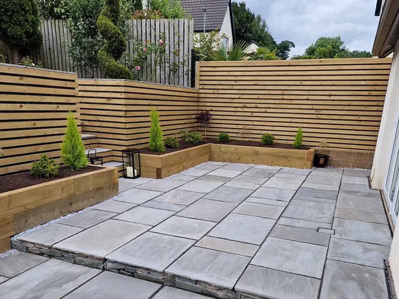Stone Patio with stairs and wooden cladding