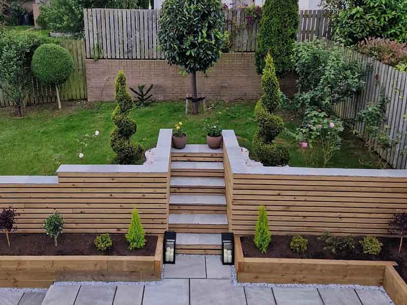 Patio with bespoke steps and woden planters
